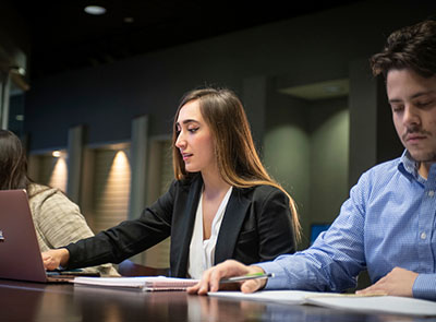 Woman and man on laptop in meeting