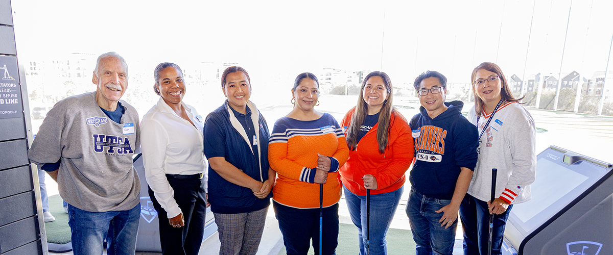 Team members chatting before meeting