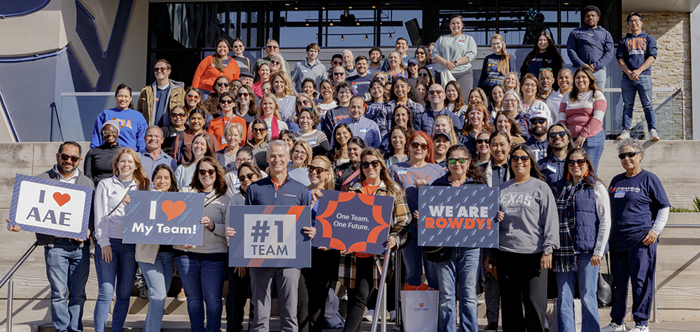 Alumni and advancement team posing at top golf location