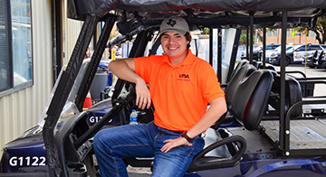 UTSA student worker on a safety escort vehicle.