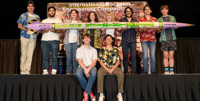 UTSA Students holding rocket they built