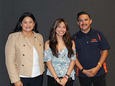 Three people posing for photo