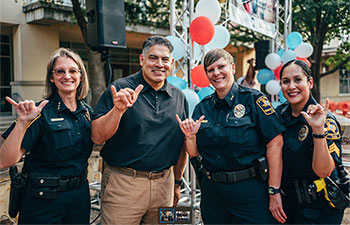 Four UTSA police officers smiling.