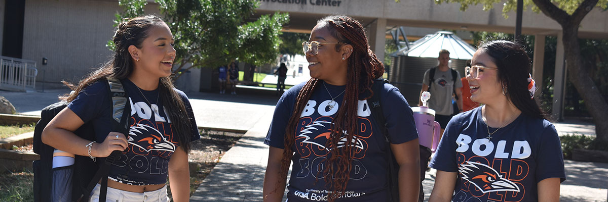 Three students at thee Paseo with Bold Scholars shirts