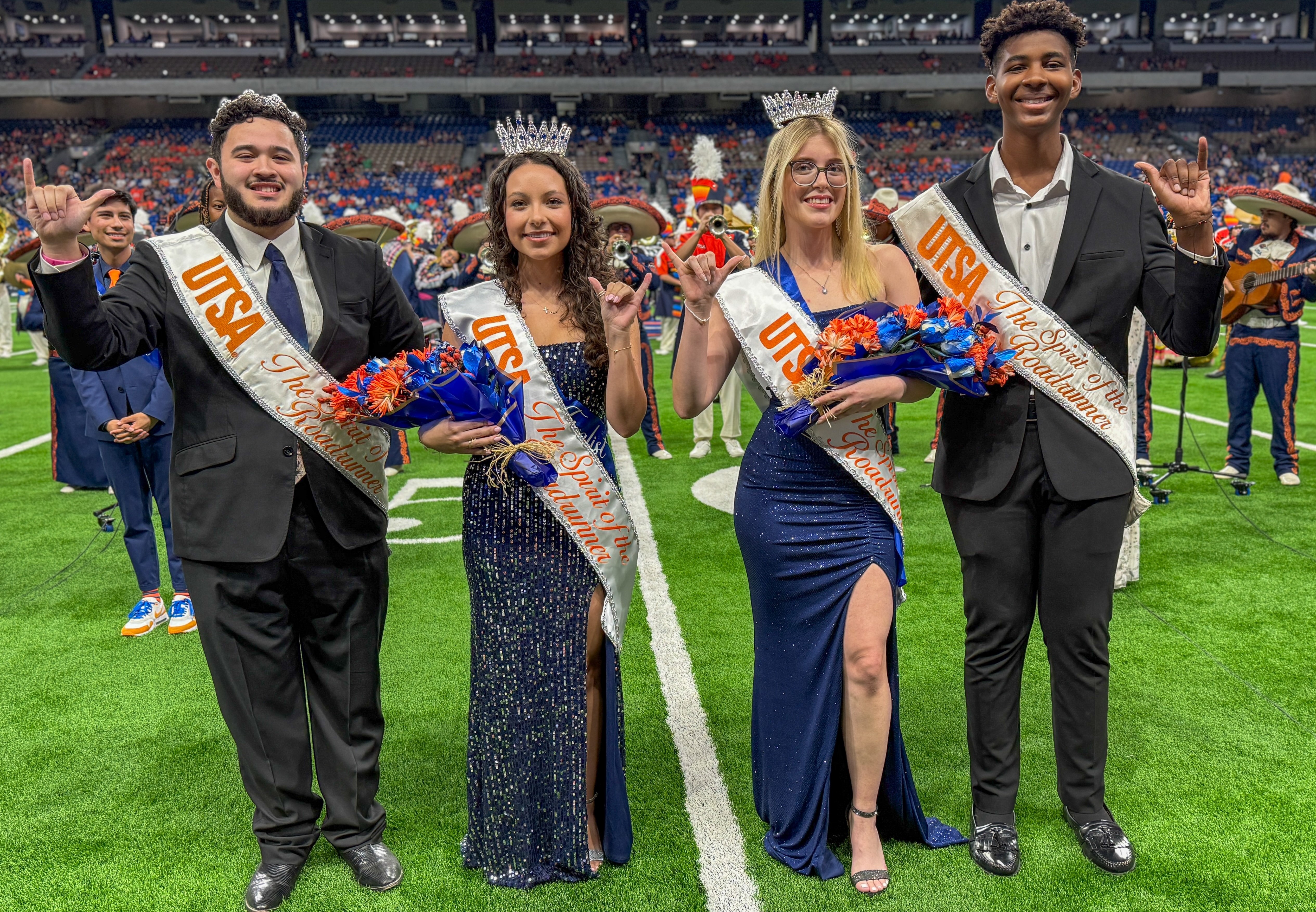 Newly crowned Spirits of the Roadrunner with the past winners on the football field