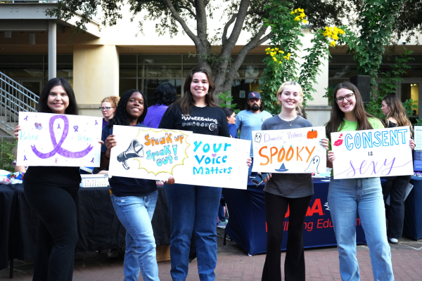 five UTSA students holding signs to spread awareness for your voice matters