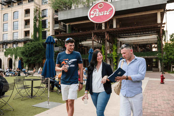 Student climbing a rock wall