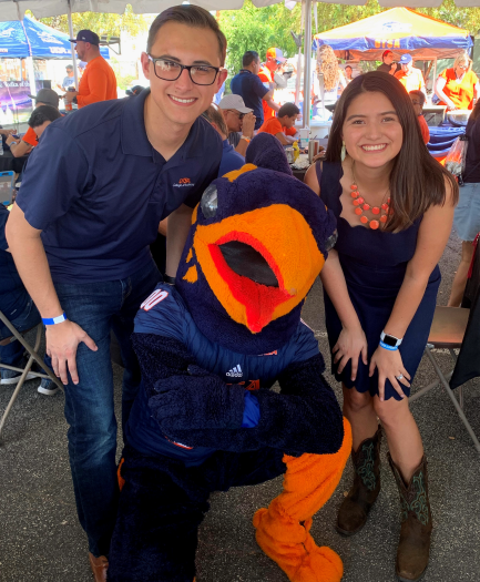 Andrew Hubbard and Carla Juarez posing with Rowdy
