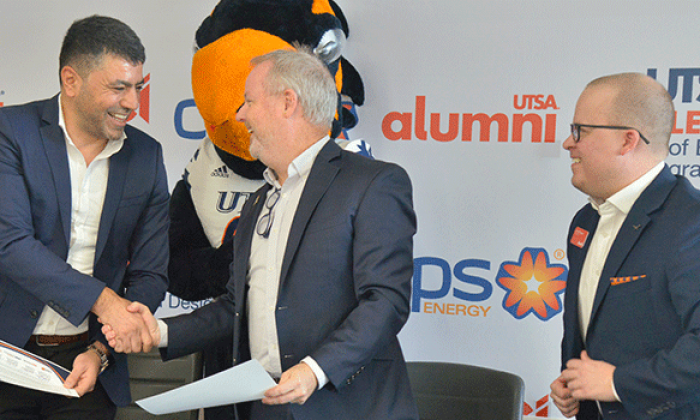 Bayatli shaking hands with Eric Bre and Russell Wagner