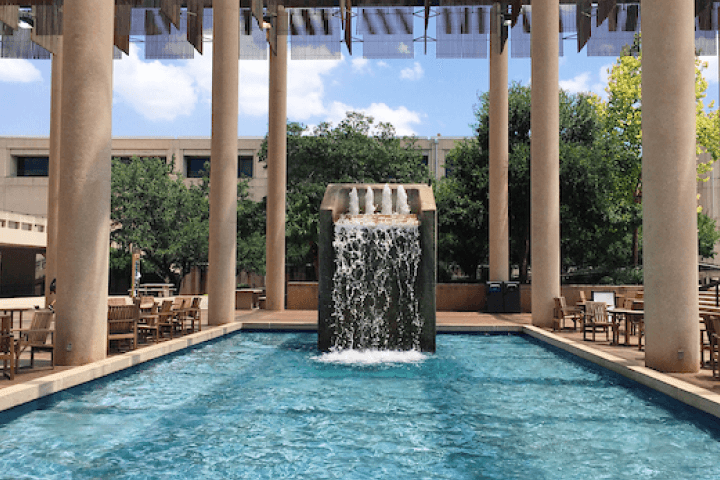 Student climbing a rock wall