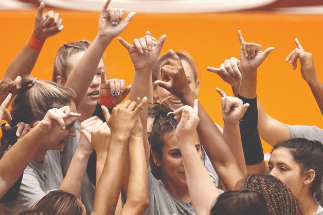 Students holding up 'Birds up' hand signals